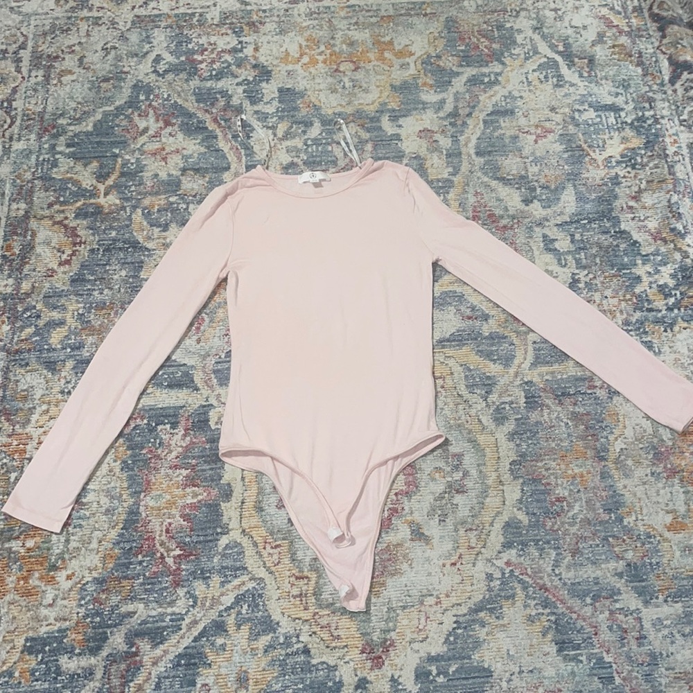 Pale pink long sleeve body suit